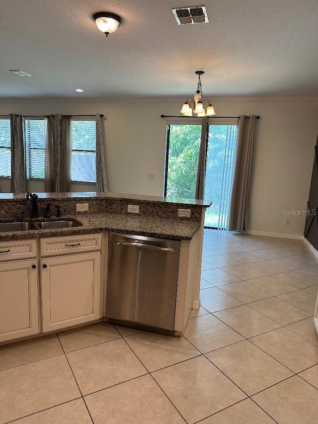 1812 Leather Fern Dr, Ocoee, FL 34761 - kitchen featuring stainless steel dishwasher, a sink, a chandelier, light tile patterned floors, and a textured ceiling