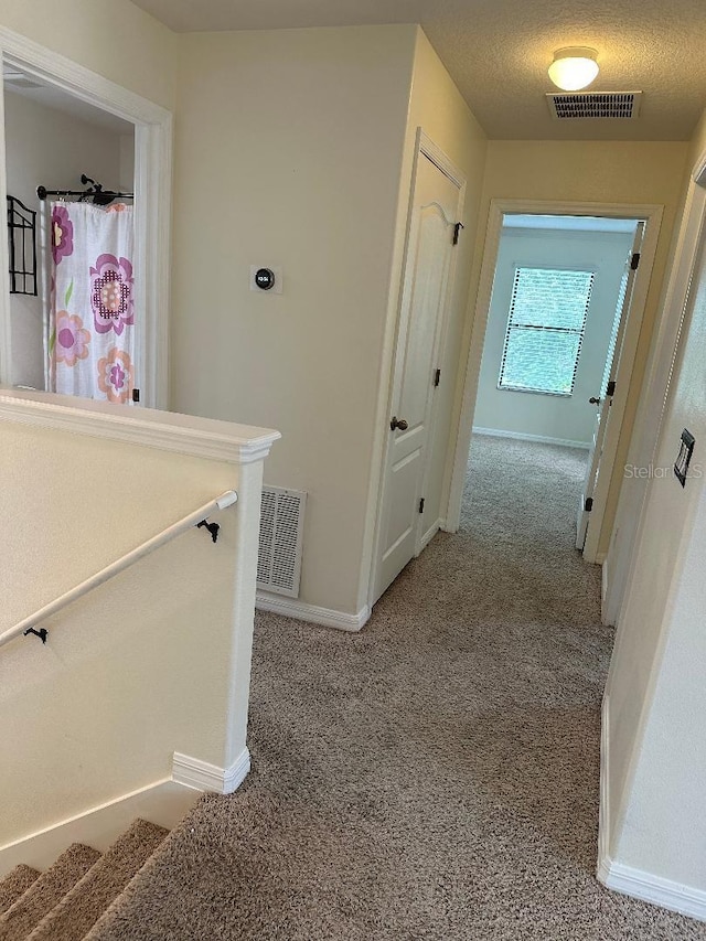 1812 Leather Fern Dr, Ocoee, FL 34761 - corridor featuring light colored carpet and baseboards