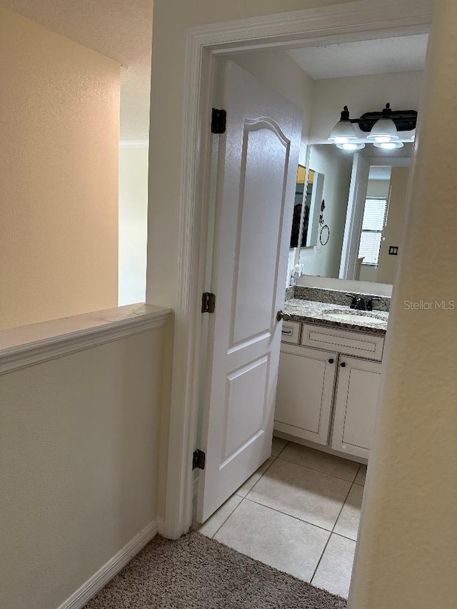 1812 Leather Fern Dr, Ocoee, FL 34761 - bathroom featuring vanity, baseboards, and tile patterned floors