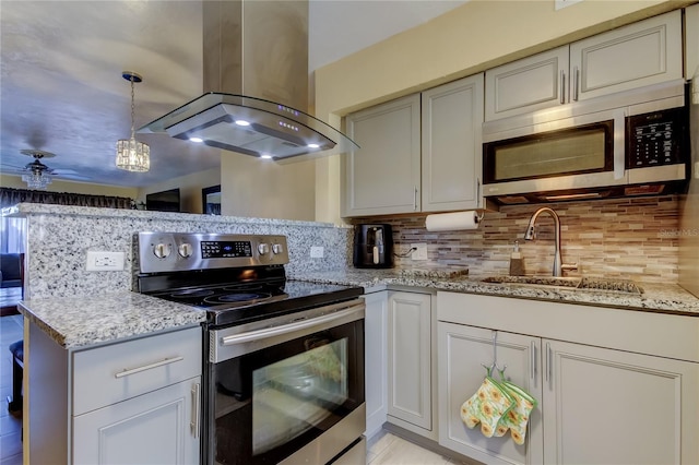 kitchen with a sink, backsplash, stainless steel appliances, and island range hood