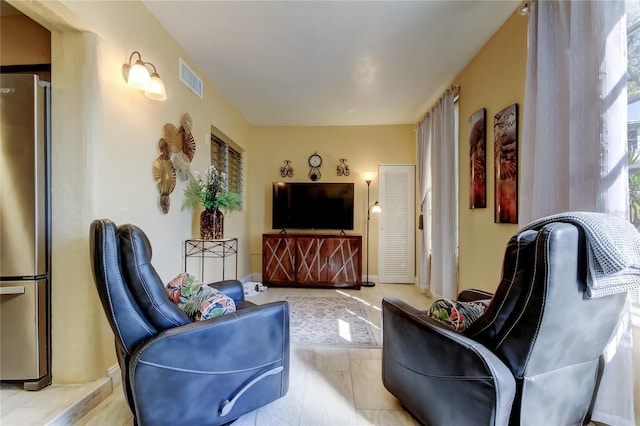 living room featuring visible vents