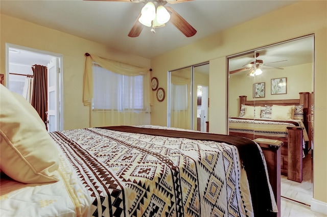 bedroom featuring two closets and a ceiling fan