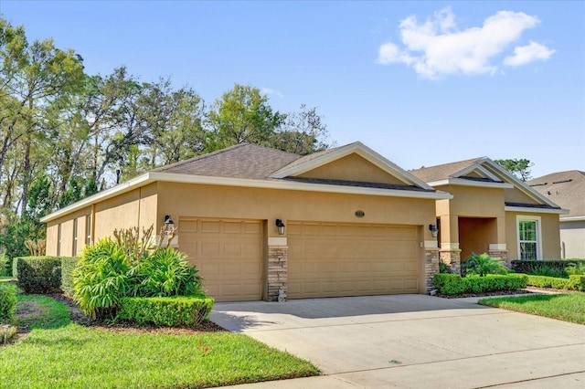 view of front facade with stone siding, a garage, driveway, and stucco siding