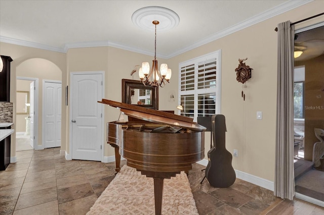 interior space with baseboards, arched walkways, and ornamental molding