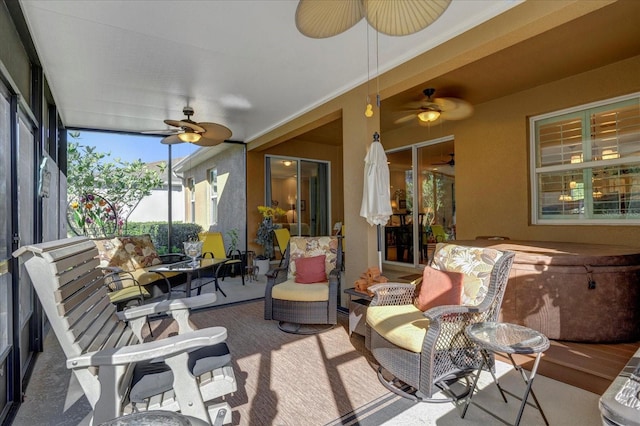 sunroom / solarium with ceiling fan