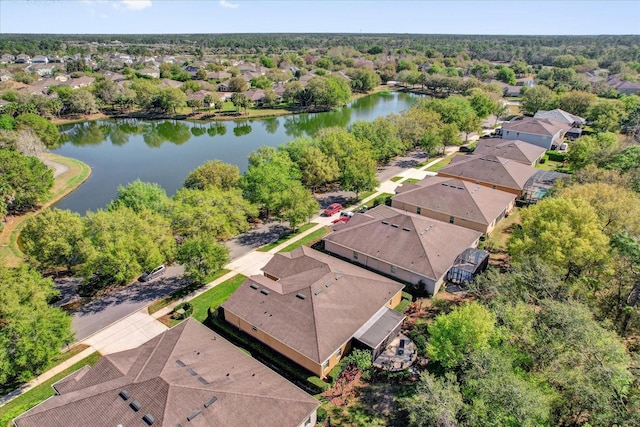 birds eye view of property featuring a residential view and a water view