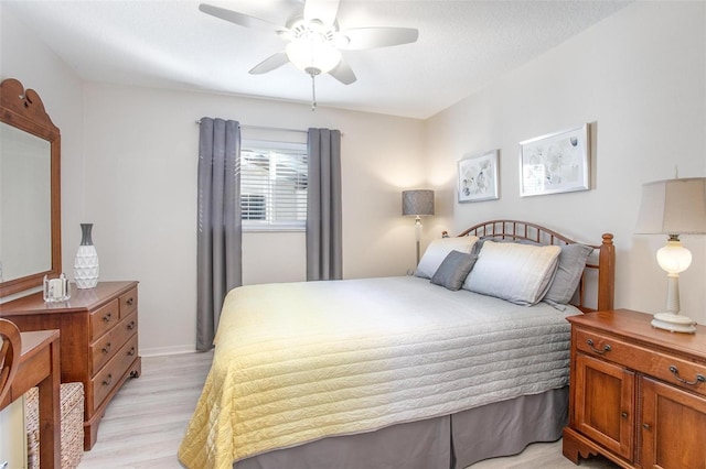 bedroom featuring light wood-style floors and ceiling fan