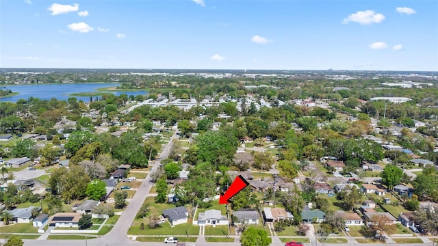 birds eye view of property with a water view and a residential view