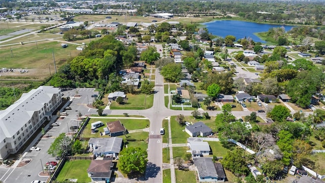 bird's eye view with a residential view and a water view