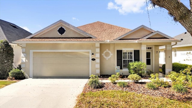 view of front of property featuring stucco siding, a garage, roof with shingles, and driveway