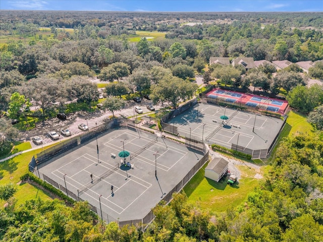 bird's eye view featuring a wooded view