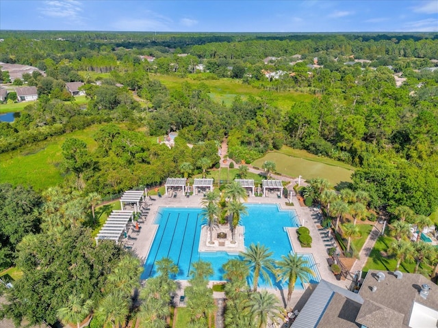 birds eye view of property with a forest view and a water view