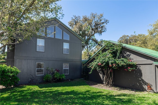 back of house with a yard