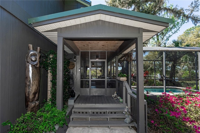 entrance to property with an outdoor pool