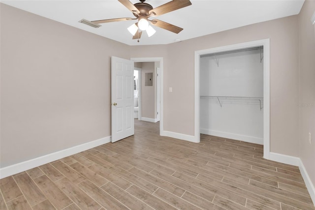 unfurnished bedroom featuring light wood-type flooring, visible vents, a closet, baseboards, and ceiling fan