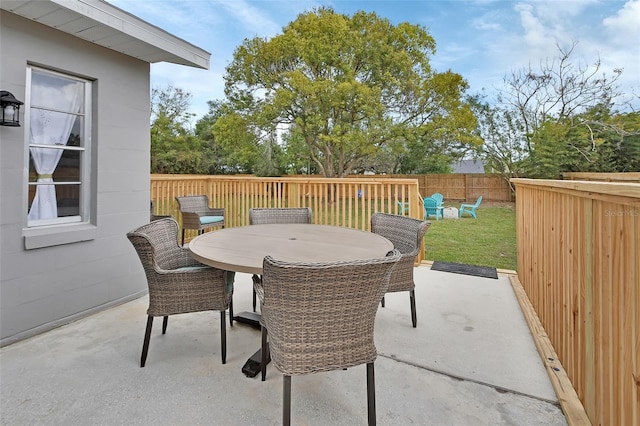 view of patio / terrace with outdoor dining area and fence