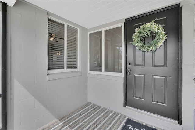 entrance to property with concrete block siding