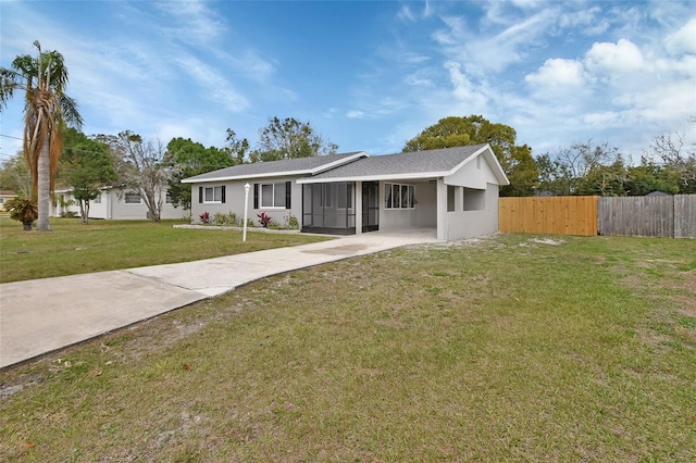 single story home with concrete driveway, a front yard, and fence