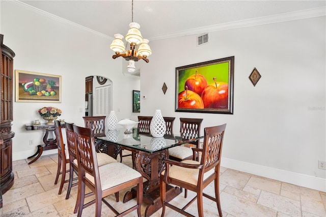 dining room featuring visible vents, ornamental molding, stone tile floors, baseboards, and a chandelier