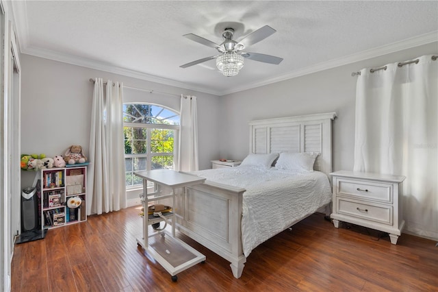 bedroom featuring a textured ceiling, crown molding, a ceiling fan, and dark wood-style flooring