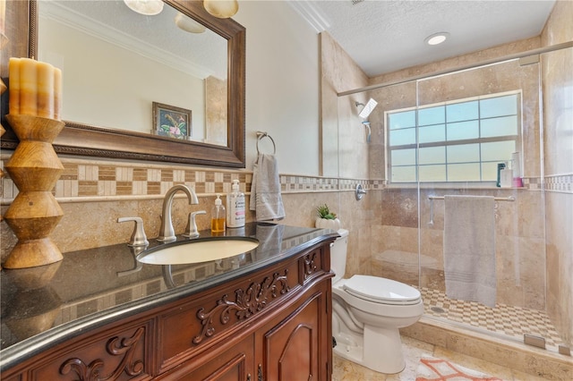 bathroom with toilet, a textured ceiling, tile walls, a shower stall, and vanity