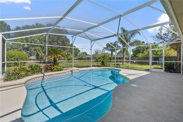 view of swimming pool with a fenced in pool, glass enclosure, a patio, and fence