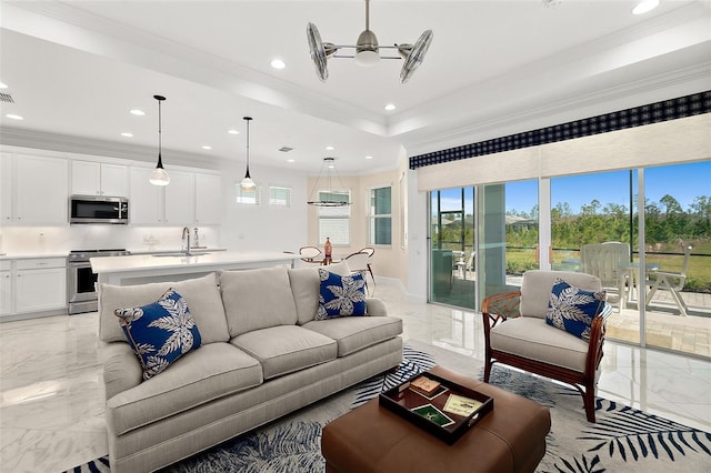 living area featuring recessed lighting, marble finish floor, ceiling fan, and crown molding