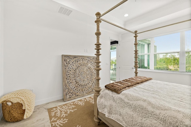 bedroom with visible vents, crown molding, baseboards, marble finish floor, and a raised ceiling