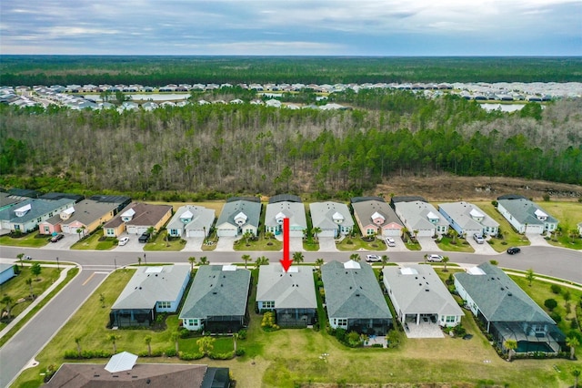 aerial view with a view of trees and a residential view