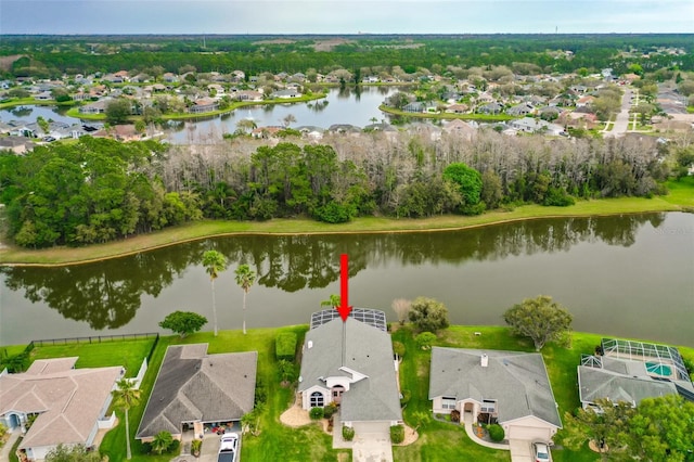 birds eye view of property with a residential view and a water view