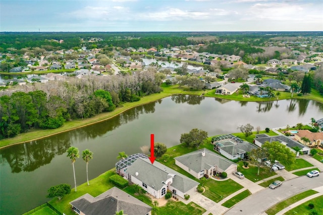 birds eye view of property with a residential view and a water view