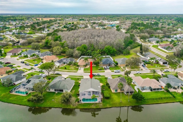 bird's eye view with a residential view and a water view