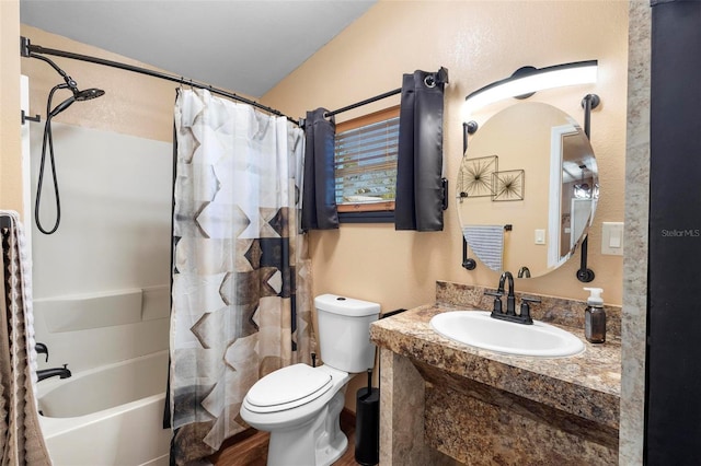 bathroom featuring toilet, vanity, and shower / bath combo