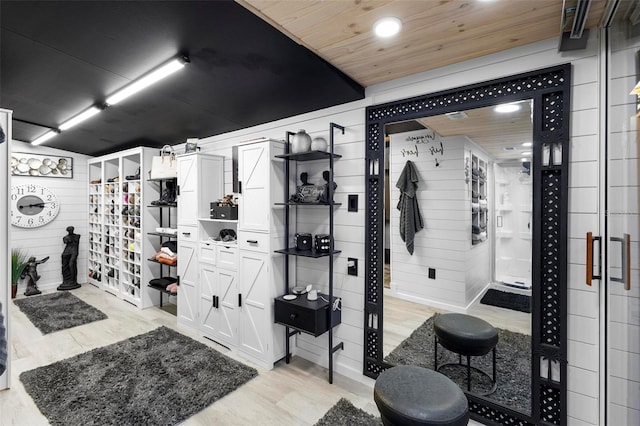 interior space featuring recessed lighting, wood finished floors, wooden ceiling, and wood walls