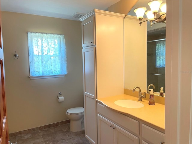 bathroom with visible vents, a chandelier, toilet, tile patterned floors, and vanity