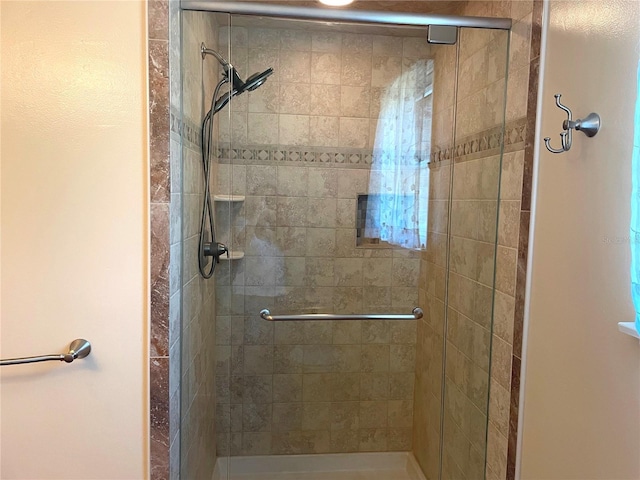 full bath with a shower stall