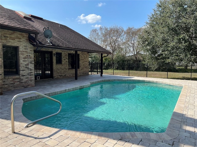 view of pool featuring a patio area, french doors, a fenced in pool, and fence private yard