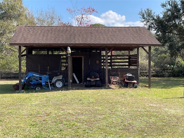 view of pole building featuring a yard and a detached carport