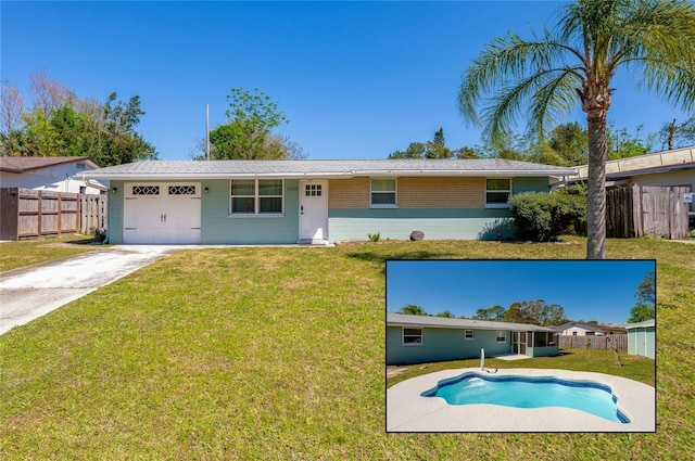 view of front facade with driveway, a front lawn, fence, an attached garage, and brick siding