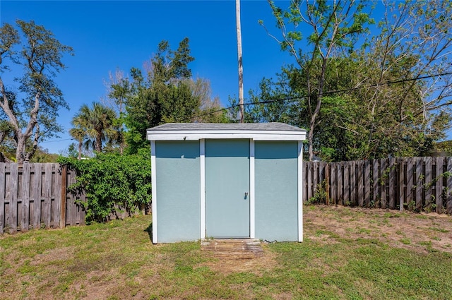 view of shed with a fenced backyard