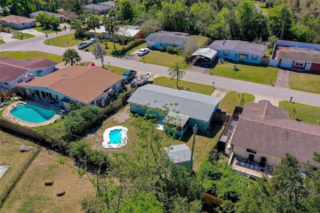 birds eye view of property with a residential view