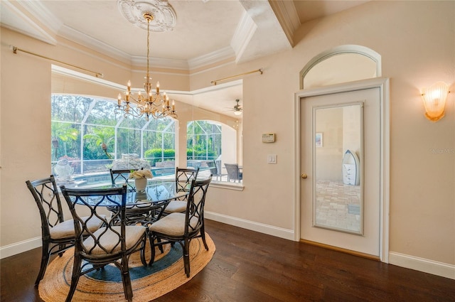 dining area featuring ornamental molding, ceiling fan with notable chandelier, baseboards, and wood finished floors