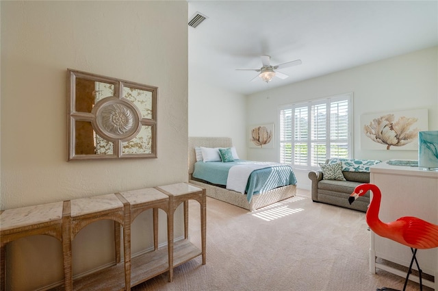 bedroom featuring visible vents, a ceiling fan, and carpet