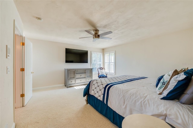 bedroom with baseboards, carpet floors, and ceiling fan