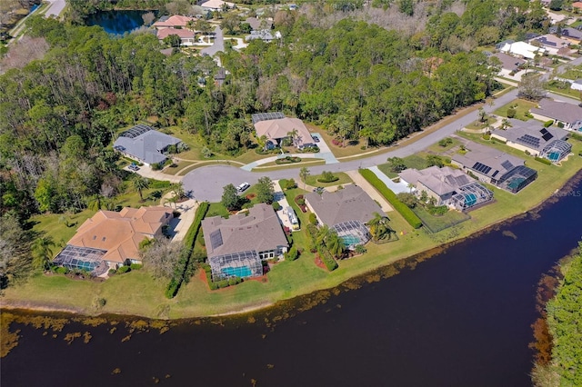 drone / aerial view featuring a residential view and a water view