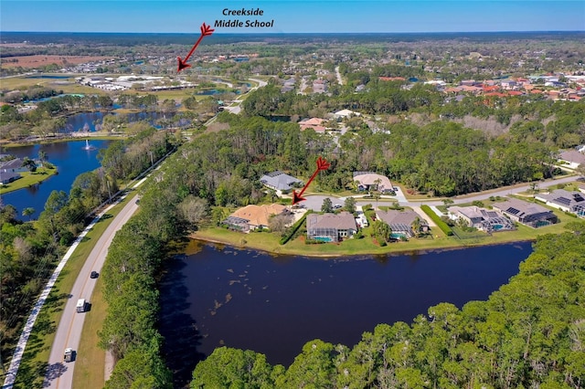 aerial view featuring a residential view and a water view