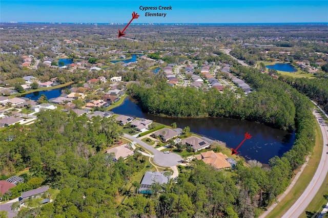 aerial view with a residential view and a water view