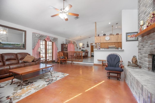 living area with visible vents, concrete floors, ceiling fan, a fireplace, and high vaulted ceiling