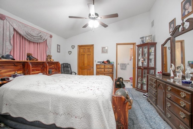 carpeted bedroom featuring ceiling fan and vaulted ceiling