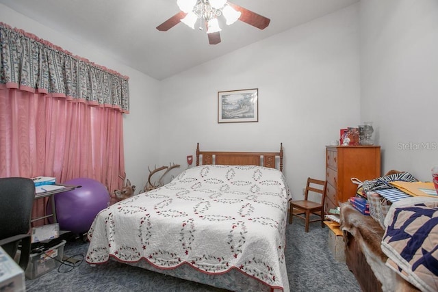 carpeted bedroom featuring lofted ceiling and a ceiling fan